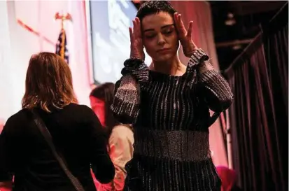  ??  ?? McGowan takes a moment after delivering her address. She said the alleged assault started her career on a destructiv­e course. But now, she says, “What I don’t feel anymore (is) despair.”