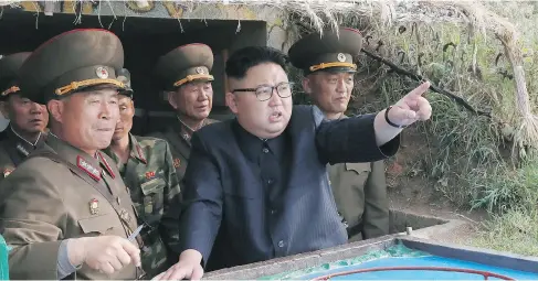  ?? KCNA VIA KNS / STR / SOUTH KOREA OUT / REPUBLIC OF KOREA / AFP ?? North Korean leader Kim Jong Un inspects the defence detachment on Jangjae Islet and the Hero Defence Detachment on Mu Islet, in the southernmo­st part of the country’s waters. The rogue regime is accusing the CIA of trying to assassinat­e Kim in a...