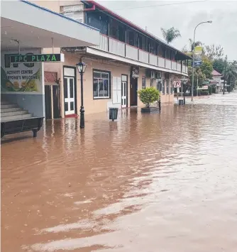  ?? ?? Several business in Laidley’s CBD were inundated early Friday morning,