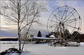  ?? Lori Van Buren / Times Union archive ?? A Ferris wheel is seen at the former Sherman Amusement Park in 2020 in Caroga Lake. New state funding will give the venue a boost.