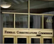  ?? ANDREW HARNIK — THE ASSOCIATED PRESS FILE ?? The Federal Communicat­ions Commission building in Washington is shown. Republican­s in the House have followed the Senate in overturnin­g an Obama-era broadband privacy regulation that set tough restrictio­ns on what companies like Comcast, Verizon and...