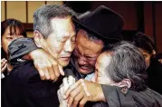  ?? ASSOCIATED PRESS 2015 ?? North Korean Son Kwon Geun, center, weeps with South Korean relatives after the Separated Family Reunion Meeting at Diamond Mountain resort, North Korea. South Korea’s Red Cross said on Monday it wants separate talks to discuss family reunions.