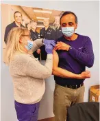 ?? COURTESY OF ALBUQUERQU­E ER AND HOSPITAL ?? Dr. Sanjay Kholwadwal­a, an emergency physician and CEO of Albuquerqu­e ER and Hospital, receives a Pfizer vaccine for COVID-19 on Jan. 7.