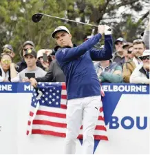  ??  ?? MELBOURNE: United States’ Rickie Fowler watches his tee shot on the 12ht hole during his match at the World Cup of golf at Kingston Heath in Melbourne, Australia, yesterday. — AP