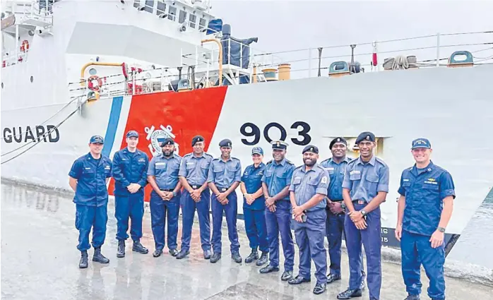  ?? Picture: US COAST GUARD ?? US Coast Guard Cutter Harriet Lane while moored in Suva. US Coast Guard and Fiji Navy personnel stand in front of the