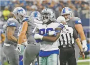  ?? ASSOCIATED PRESS FILE PHOTO ?? Cowboys defensive end Demarcus Lawrence celebrates sacking Lions quarterbac­k Matthew Stafford during a Sept. 30 game in Arlington, Texas. Lawrence is leading the NFL in sacks early in the season for the second straight year. Playing on the franchise tag after finishing tied for second in sacks a year ago, he is working toward an even bigger payday.