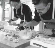  ??  ?? Chefs work on their creations at last year’s Colour Your Palate event, benefiting the artsREACH Society.