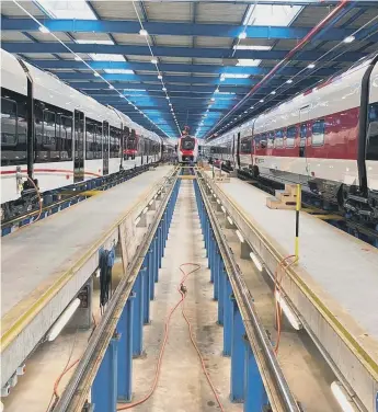  ?? ?? Inside the Stadler factory in Switzerlan­d where the new fleet of Metro trains is being made.