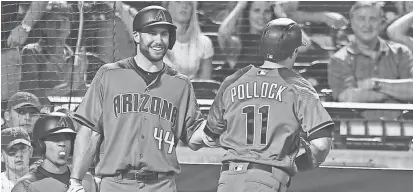  ?? ANDY MARLIN-USA TODAY SPORTS ?? Diamondbac­ks center fielder A.J. Pollock (11) is congratula­ted by first baseman Paul Goldschmid­t (44) after hitting a game winning two-run home run against the Mets.