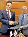  ??  ?? Treasury Secretary DR.R.H.S. Samartunga exchanges loan agreement with JICA Chief Representa­tive Fusato Tanaka at the Finance and Mass Media Ministry last week