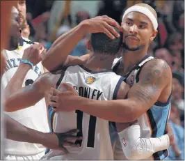  ?? NIKKI BOERTMAN/ THE COMMERCIAL APPEAL ?? Grizzlies guard Jarryd Bayless (right) embraces guard Mike Conley after Conley hit the gamewinnin­g basket against the San Antonio Spurs at FedExForum Monday night.