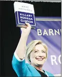  ?? (AFP) ?? Former US Secretary of State Hillary Clinton holds up a copy of her new book ‘What Happened’ at a book signing event at Barnes and Noble bookstore, on Sept 12,
in New York City.
