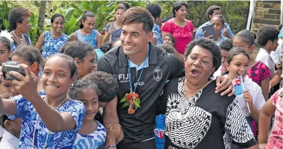  ?? Photo: Ronald Kumar ?? Fiji Airways Flying Fijians flyhalf Ben Volavola is a popular figure among students and parents of St Anne’s Primary School in Suva on June 13, 2018.