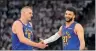  ?? PHOTO: AP ?? Denver Nuggets center Nikola Jokic, left, and guard Jamal Murray slap hands during the second half of Game 3 of their NBA Western Conference semi-final series against the Minnesota Timberwolv­es in Minneapoli­s on Friday.