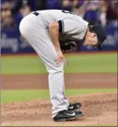  ?? FRANK GUNN — THE CANADIAN PRESS VIA ASSOCIATED PRESS ?? Yankees relief pitcher Tyler Clippard reacts after giving up what proved to be the game-winning homer to Blue Jays' Josh Donaldson in the eighth inning of Sunday's game at Toronto.