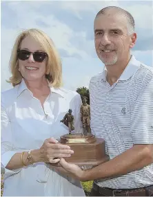  ?? HERALD PHOTOS BY MARK LORENZ ?? BEST OF THE BEST: From left, Jacquelyn Eleey, Matt Parziale and Jim DiBiase — shown with Cynthia Wilcox and the Eddie Lowery Senior Trophy — celebrate their wins at the Ouimet Tournament at Woodland Golf Club.