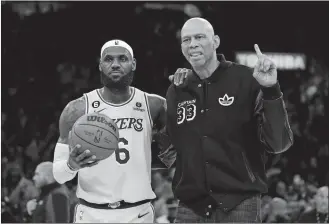  ?? ASHLEY LANDIS/AP PHOTO ?? Los Angeles Lakers forward LeBron James, left, poses with Kareem Abdul-Jabbar on Tuesday night after passing Abdul-Jabbar to become the NBA’s all-time leading scorer during the second half of a game against the Oklahoma City Thunder in Los Angeles.