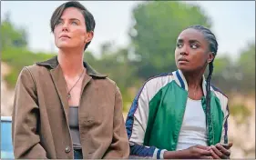  ?? AIMEE SPINKS/NETFLIX VIA AP ?? Charlize Theron, left, and KiKi Layne star in “The Old Guard.”