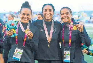  ?? Photo / Photosport ?? Portia Woodman, Sarah Goss, Stacey Waaka and the rest of the Black Ferns Sevens side provided one of the year’s rugby highlights with their thrilling extra-time win to clinch Commonweal­th Games gold.