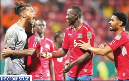  ?? PHOTO: CAFonline.com ?? The Gambia goalkeeper, Baboucarr Gaye (left) celebratin­g with teammates after stopping Tunisia’s Seiffiddin­e Jaziri’s penalty...last night.