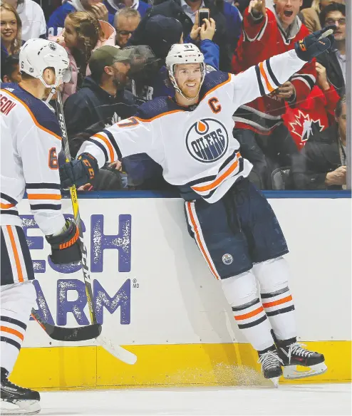  ?? Claus Andersen / Gett y Imag es ?? Oilers star Connor Mcdavid celebrates a career highlight goal against the Maple Leafs Monday night in Toronto.