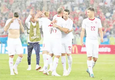  ?? – Reuters photo ?? Switzerlan­d’s Valon Behrami and Blerim Dzemaili celebrate after the match against Serbia Kaliningra­d Stadium, Kaliningra­d, Russia, June 22, 2018.