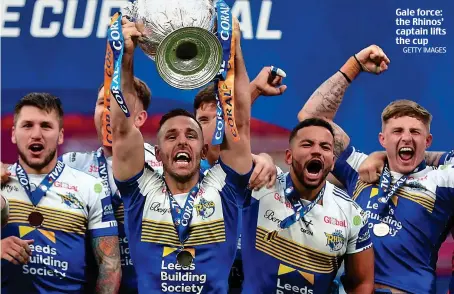  ?? GETTY IMAGES ?? Gale force: the Rhinos’ captain lifts the cup