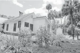  ?? ORLANDO SENTINEL ?? A flower, herb and vegetable garden grows behind the home of author Marjorie Kinnan Rawlings in Cross Creek. Visitors can tour the home where she wrote “The Yearling” and other Florida classics.