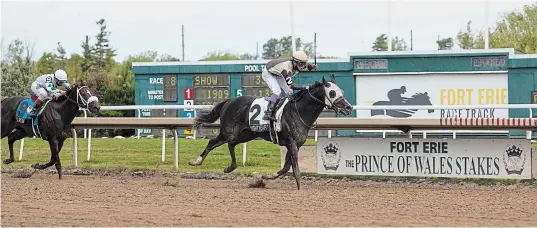  ?? PHOTOS BY JULIE JOCSAK
TORSTAR FILE PHOTO ?? Daisuke Fukumoto, aboard Mighty Heart, wins the 85th Prince of Wales Stakes at Fort Erie Race Track on Sept. 28, 2020.