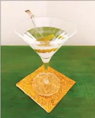  ?? ELIZABETH KARMEL VIA AP ?? This photo shows a "Smoked Martini" from a recipe by Elizabeth Karmel, in Amagansett, N.Y. A whiff of scotch whisky lends a smokey note to an ice cold vodka martini.