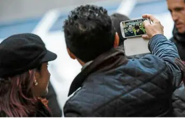  ??  ?? a couple taking a ‘selfie’ using a smartphone. Smartphone­s have many useful functions but can cause awkward moments in the bedroom. — Filepic