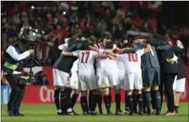 ?? ANGEL FERNANDEZ — THE ASSOCIATED PRESS FILE ?? A TV camera operator films Sevilla players celebratin­g at the end of the match during La Liga soccer match against Real Madrid at the Ramon Sanchez Pizjuan stadium, in Seville, Spain on Jan. 15. La Liga is sending a clear message that it will not allow...