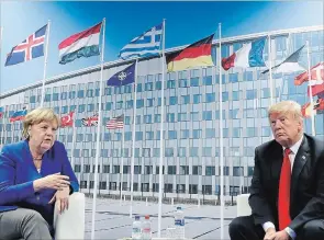  ?? PABLO MARTINEZ MONSIVAIS THE ASSOCIATED PRESS ?? President Donald Trump and German Chancellor Angela Merkel during their bilateral meeting, Wednesday in Brussels, Belgium.