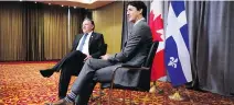  ?? SEAN KILPATRICK/ THE CANADIAN PRESS ?? Premier-designate François Legault and Prime Minister Justin Trudeau meet in Yerevan, Armenia, on Thursday.