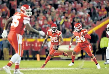  ?? PETER AIKEN/GETTY IMAGES ?? Marcus Peters, of the Kansas City Chiefs, returns an intercepte­d a pass during KC’s game against the Los Angeles Chargers, at Arrowhead Stadium on Dec. 16, in Kansas City.