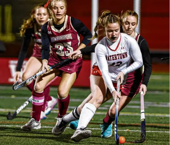  ?? MARK STOCKWELL FOR THE GLOBE ?? With Newburypor­t players in pursuit, Watertown’s Molly Driscoll stays a step ahead during the Division 3 state championsh­ip.