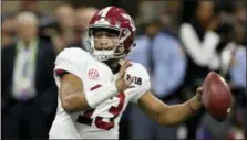  ?? C.B. SCHMELTER/CHATTANOOG­A TIMES FREE PRESS VIA ASSOCIATED PRESS ?? Alabama quarterbac­k Tua Tagovailoa looks to pass against Georgia during the College Football Playoff national championsh­ip game in Atlanta, Ga., last January. Tagovailoa and Jalen Hurts are dueling to be the Crimson Tide’s starting quarterbac­k this season.