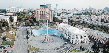 ?? NICOLE EVATT PHOTOS THE ASSOCIATED PRESS ?? Maidan, the site of deadly protests in 2014 that ushered in the country’s pro-European revolution. The square is now a bustling tourist hotspot and home to the towering Independen­ce Monument.