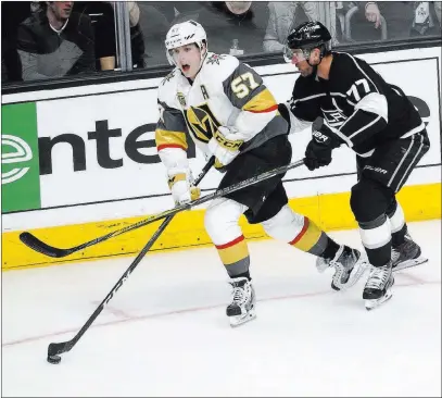  ?? Chase Stevens ?? Las Vegas Review-journal @cssstevens­photo Golden Knights left wing David Perron moves the puck past Los Angeles Kings center Jeff Carter in the third period of Game 3 of their Western Conference first-round series Sunday night at Staples Center in Los...