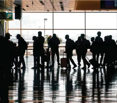  ?? Rick Bowmer / Associated Press ?? At Salt Lake City Internatio­nal Airport, passenger traffic is down 40 percent when compared with last year. But at Provo Municipal Airport, an hour away, traffic is down just 2 percent.