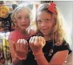  ?? JOHN LAW TORSTAR ?? Clare Craig, left, and Antonella Terreberry sold their bracelets to assist Project Share.