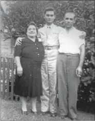  ?? PHOTO COURTESY OF THERESA SELL ?? Anthony Marchione, center, stands in the yard of the family home at 558 King St. in Pottstown. With him are his parents, Emilia and Ralph Marchione.