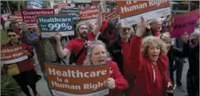  ?? PHOTO/RICH PEDRONCELL­I ?? In this April 26 file photo, supporters of single-payer health care march to the Capitol in Sacramento. AP