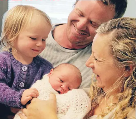  ?? Photo: CAMERON BURNELL/FAIRFAX NZ ?? Rock and roll arrival: Parents Ben Gilpin and Toni Midwinter with daughter Tammy, 1, and their newborn son Miles, who was born at the very moment Monday’s magnitude 6.2 quake struck Wellington.