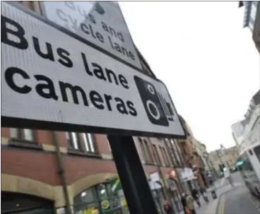  ??  ?? Signs across the city warn motorists to avoid using lanes that are deemed for bus use only