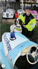  ?? ?? 5. PC Kelly Manifield and explosives dog Peggy (both genuine) on patrol in the J40 parc ferme.
