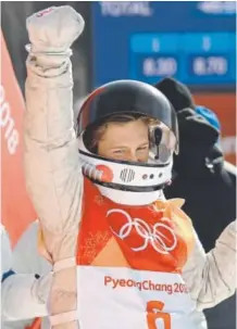  ?? Hyoung Chang, The Denver Post ?? Silverthor­ne snowboard-riding phenom Red Gerard enjoys the spoils of his monster third run Sunday, which earned him a gold medal.