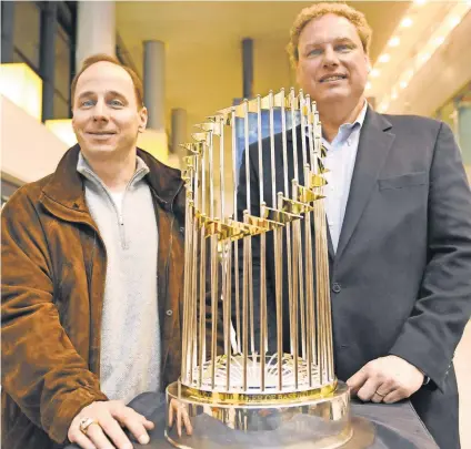  ?? 2009 PHOTO BY KAZUHIRO NOGI, AFP/GETTY IMAGES ?? GM Brian Cashman, left, and President Randy Levine might be at odds over roster strategy.