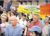  ?? Genaro Molina Los Angeles Times ?? LOS ANGELES Councilman Mike Bonin, left, fields questions on the shelter plan from Venice residents.