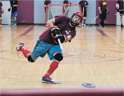  ?? JESSICA NYZNIK/ EXAMINER ?? Peterborou­gh Wolves player Brandon Vansickle takes a shot on the net during a Special Olympics floor hockey practice.